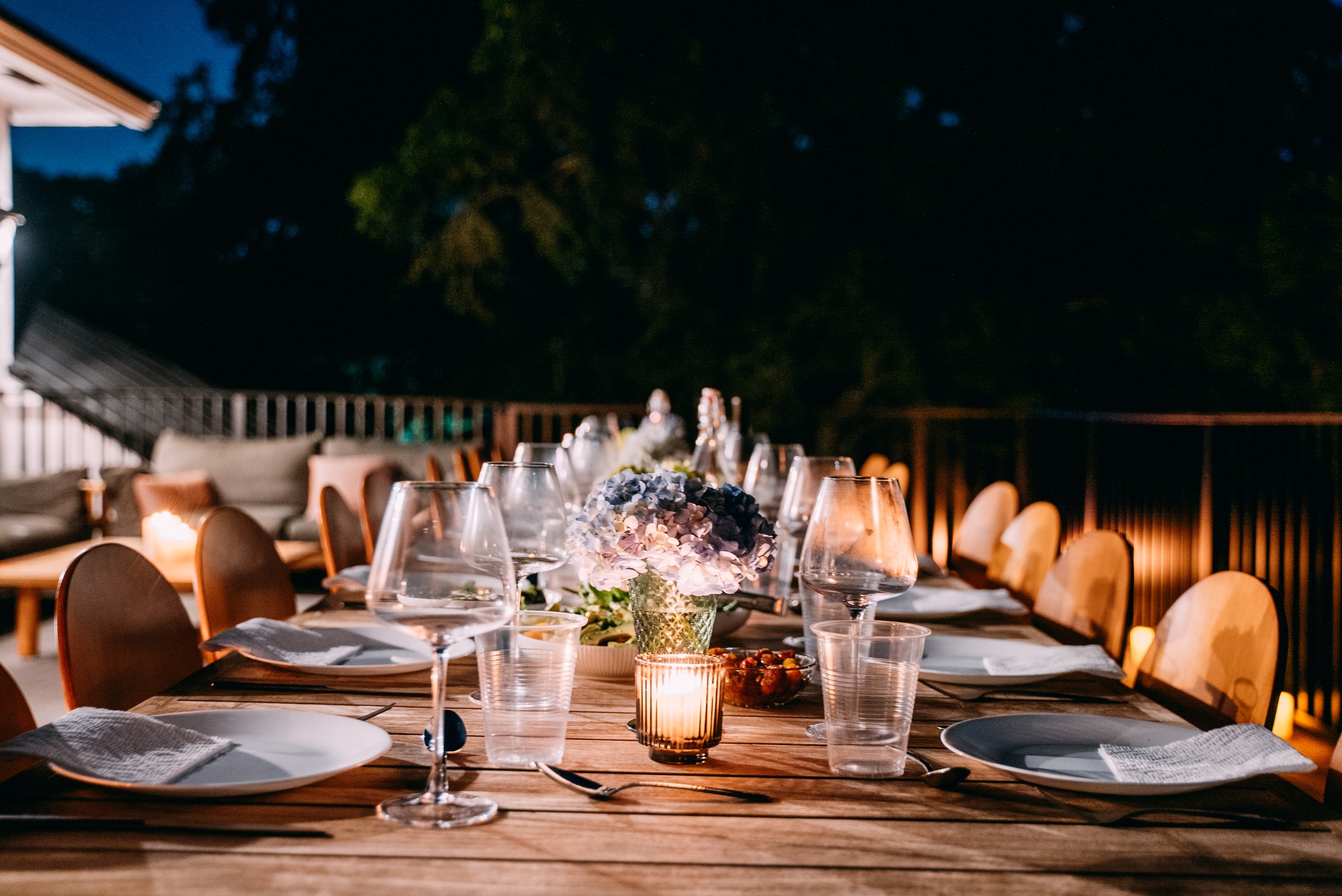 A candlelit table prepared for an evening at Ahdama