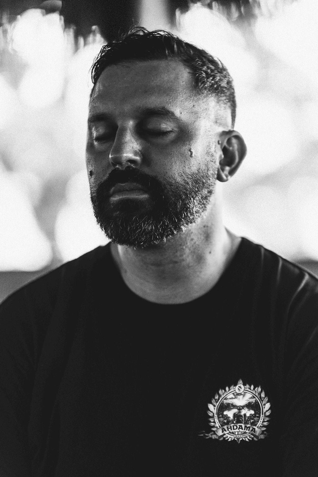 A man sitting in stillness at Ahdama