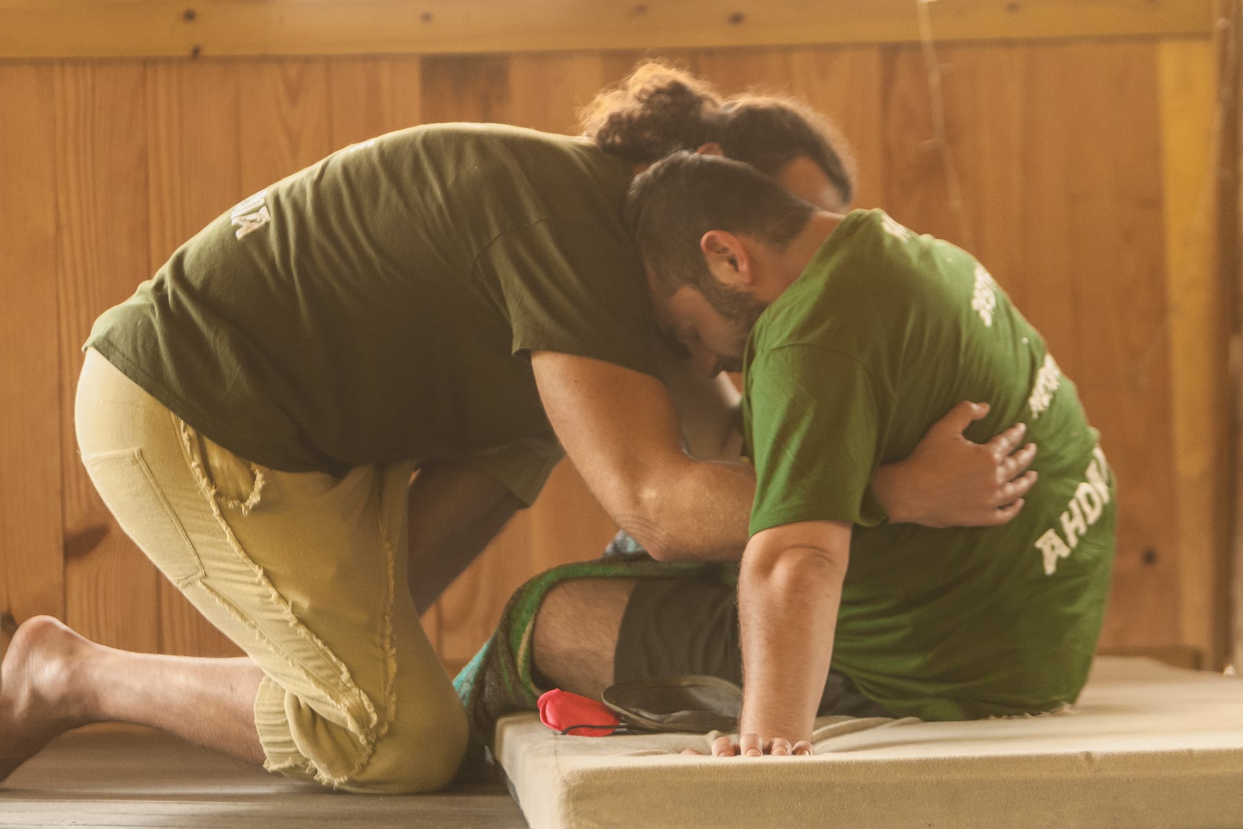 Men supporting one another during breathwork
